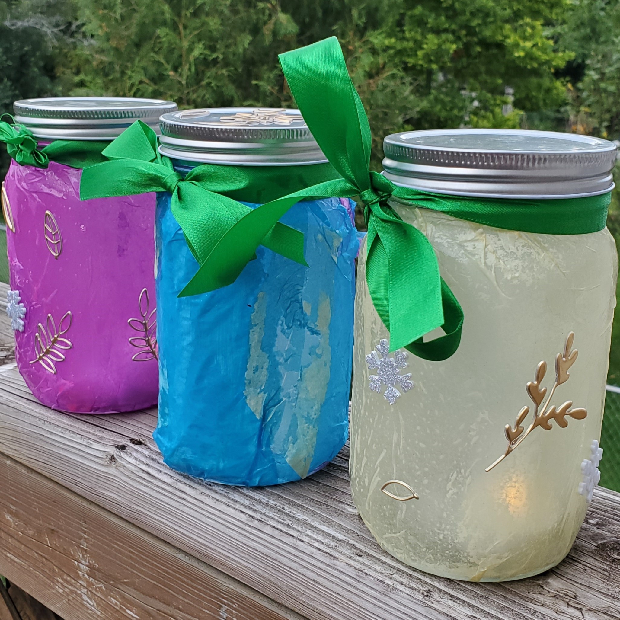 Image featuring three decorated wishing jars- pink, blue, and white.