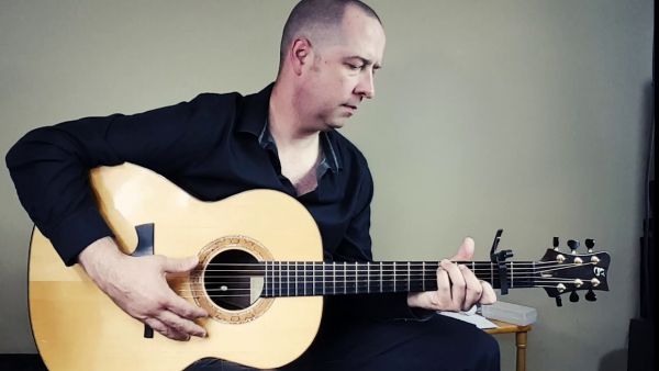 man playing guitar