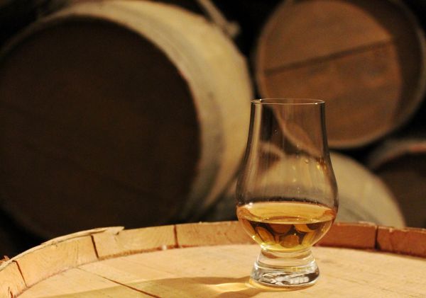 Whisky glass on a cask