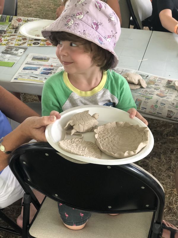 girl holding pottery